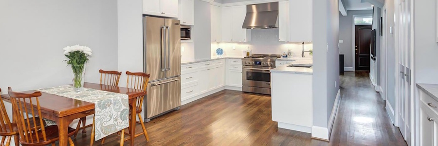 Panoramic view of dining area, kitchen, and entry hall